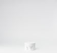 White jar with black label on a white background


