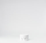 White jar with black label on a white background

